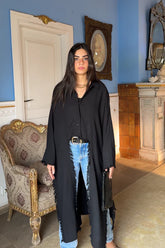 Fringed out cape in black