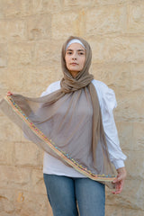 A coffe soft cotton scarf with a colorful trim.