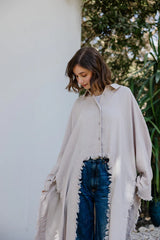 Fringed out cape in Beige