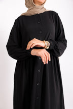 Flowy button-down dress with ruffle details and side pockets.
Code 507