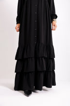 Flowy button-down dress with ruffle details and side pockets.
Code 507