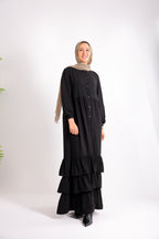 Flowy button-down dress with ruffle details and side pockets.
Code 507
