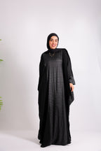 A luxurious silk abaya with embroidered silk accents, designed with an inner belt Code 405