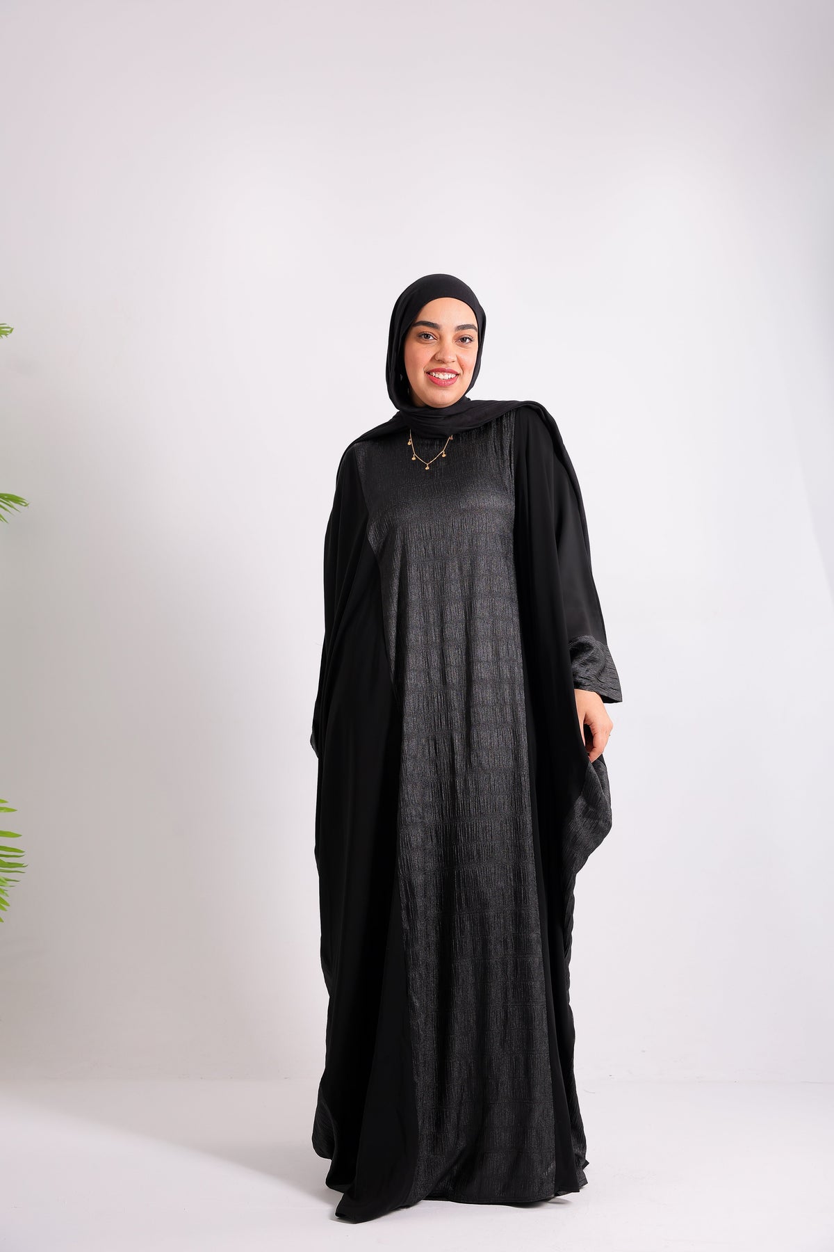 A luxurious silk abaya with embroidered silk accents, designed with an inner belt Code 405
