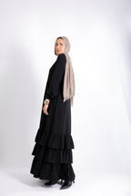 Flowy button-down dress with ruffle details and side pockets.
Code 507