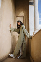 Fringed out cape in olive