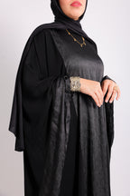 A luxurious silk abaya with embroidered silk accents, designed with an inner belt Code 405